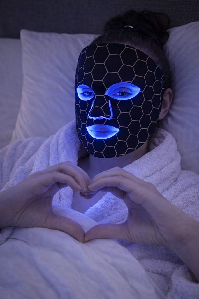 blue LED light therapy mask night routine selfcare moment relaxing skincare in bed