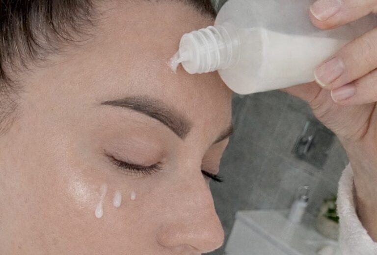 Woman applying hydrating toner to sensitive skin as part of her skincare routine