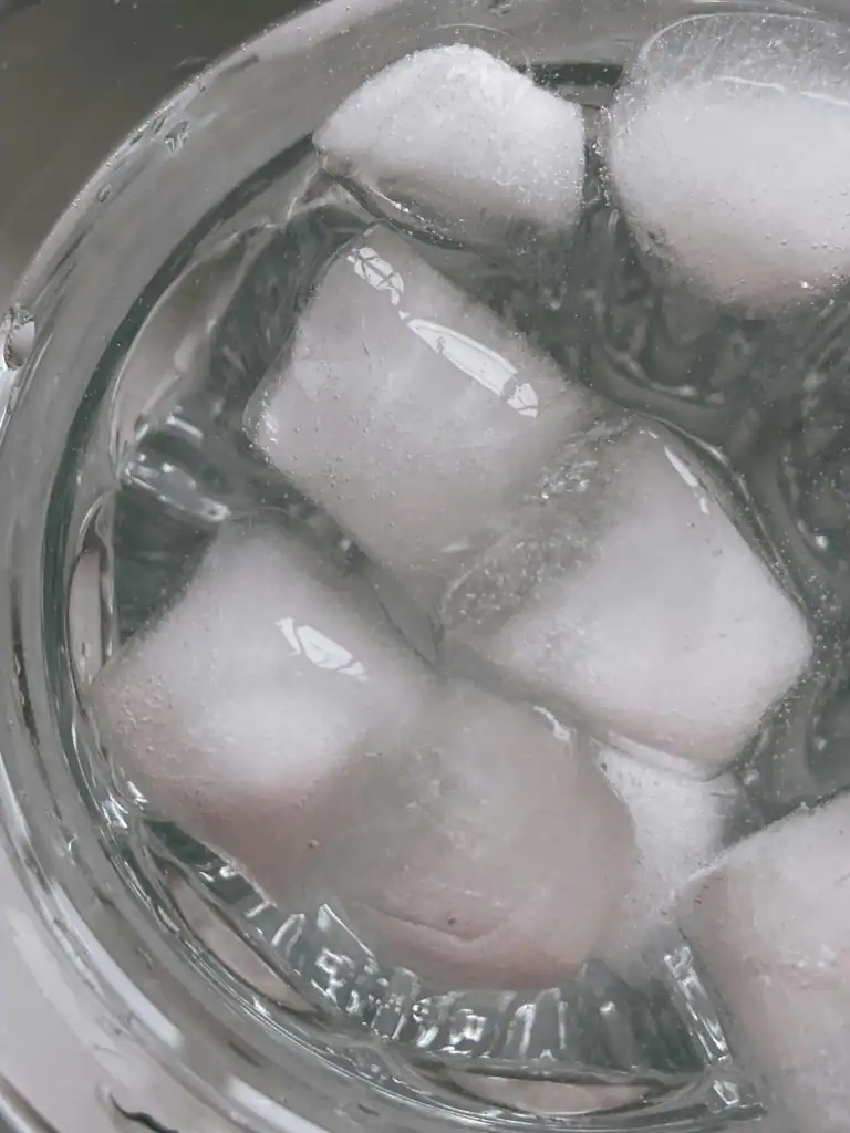 ice water face routine bowl with cold water and ice cubes